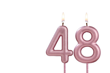 Candle number 48 - Lit birthday candle on white background