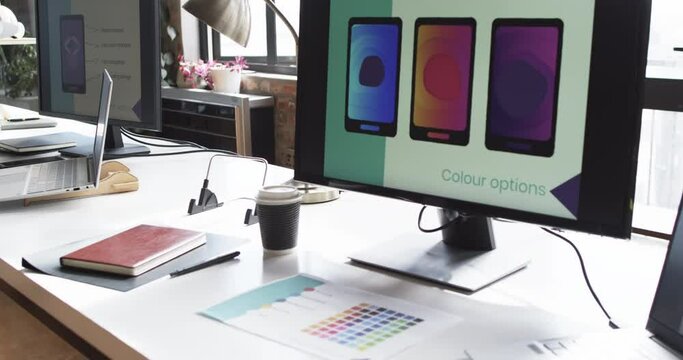 Computer monitor in a business office setting displays color options for phone app