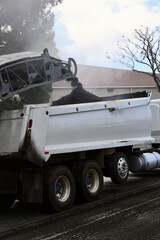 Fototapeta premium asphalt milling machine grinds up the old layer