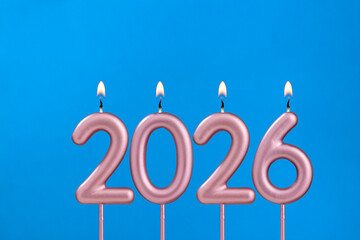 Happy new year 2026 candles - Cupcake on blue background