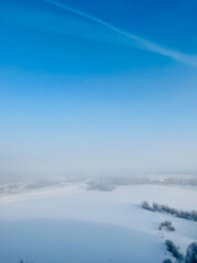Winter white foggy landscape of a frozen city in Siberia