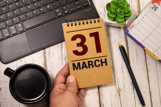 March 31st. Image of march 31 wooden color calendar on white brick wall background. empty space for text. World Backup Day and the month end