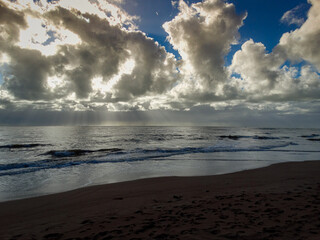 Beautiful morning in front of the sea, with blue sky and lots of clouds. On a secluded beach in Porto Segura, Bahia.