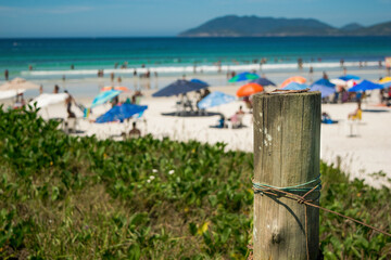 Beautiful shore, beach with lots of rocks, people strolling, located in the city of Cabo Frio, Rio de Janeiro.