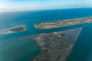 Daniel K. Inouye International Airport runway . Aerial photography of Honolulu to Hilo from the...