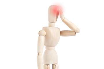 Wooden drawing dummy isolated touching his head with one hand. Representation of headache.