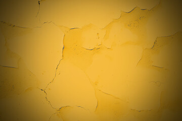 Yellow cement concrete grunge textured floor background. Gold amber wall with cracks. Old vintage wide backdrop for design banner