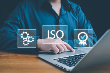 ISO standards quality control, assurance and warranty business technology concept. Touching on screen with ISO and globe icons on smart background. ISO Standard certification. Modern ISO banner