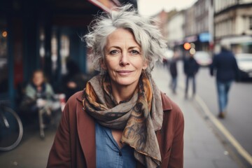 Portrait of senior woman with short hair on the street in London