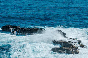 Waves Crashing Against Basalt Rocks. Kahekili Hwy, Wailuku, Maui Hawaii. Olivine Pools trail. reef