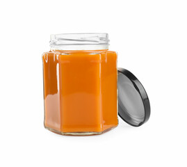 Delicious persimmon jam in jar isolated on white