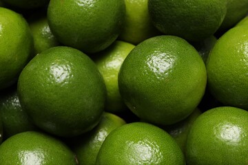 Many fresh ripe limes as background, closeup