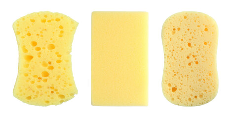 Different yellow sponges isolated on white, top view