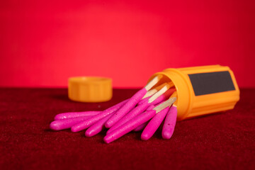 box of windproof and waterproof match sticks on red background at horizontal composition