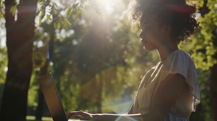 Euphoric woman searching job with a laptop in an urban park in summer : Generative AI