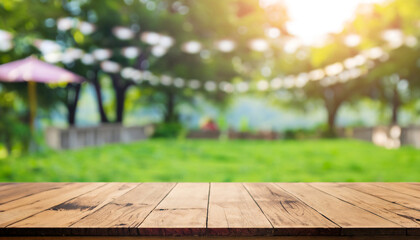 Empty wooden table with party in garden background blurred. and beautiful natural scenery view - obrazy, fototapety, plakaty