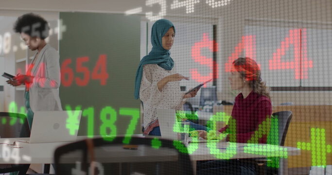 Image of financial data processing over diverse business people in office