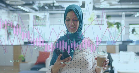 Image of financial data processing over biracial businesswoman in hijab working in office