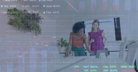 Image of financial data processing over diverse business people in office
