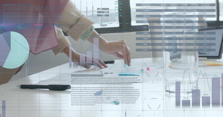 Image of financial data processing over caucasian businesswoman working in office