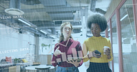 Image of financial data processing over diverse businesswomen in office