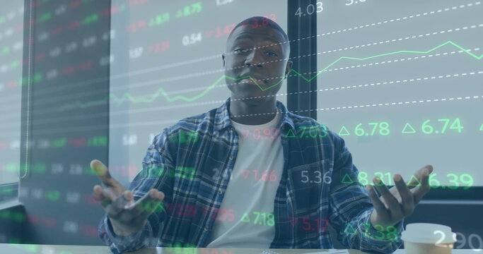 Image of financial data processing over african american businessman working in office