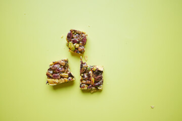 Almond , Raisin and oat protein bars on table 