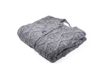 Folded knitted sweater on white background