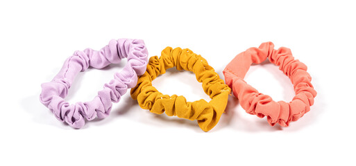 colourful hair scrunchies on white background