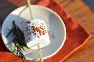 marshmallow with chocolate powder topping or marshmallow for fondue