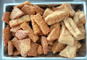 Fried Tempeh and Tofu. One of composition Gudangan. Javanese traditional menu. Vegetable protein.
