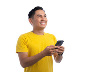 Handsome Asian man using smartphone and looking up while smiling isolated on white background