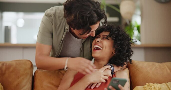 Surprise, kiss and lesbian couple on a sofa with love, hello or excited for coming home reunion together. Happy, playful and lgbtq people in living room with hands on eyes for wow, moment or romance