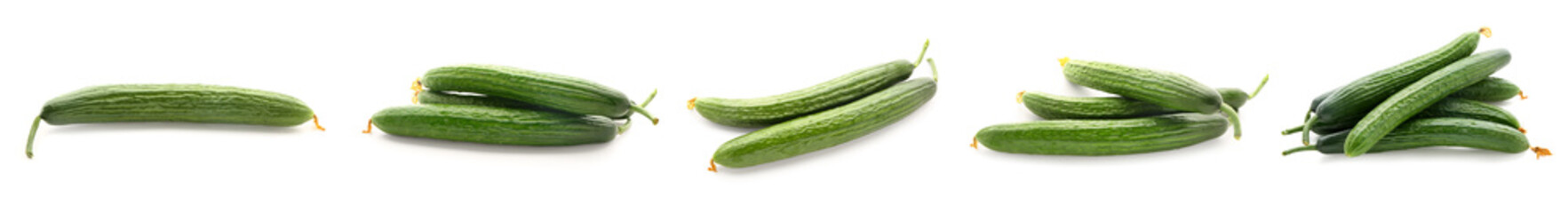 Set of ripe cucumbers on white background