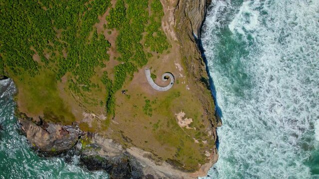 Aerial view rotating above the Muelle del Tiempo, sunny day in Chiloe, Chile