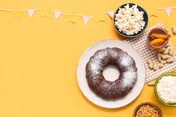 Traditional food with flags for Festa Junina (June Festival) on yellow background