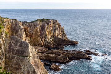 Fototapeta na wymiar Sandanbeki Rock Cliff on Pacific coast in Shirahama Town in Wakayama prefecture Japan