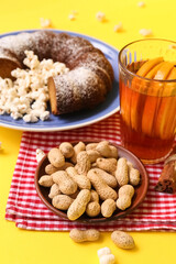 Traditional food for Festa Junina (June Festival) on yellow background, closeup
