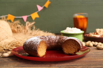 Traditional corn cake for Festa Junina (June Festival) on wooden table, closeup