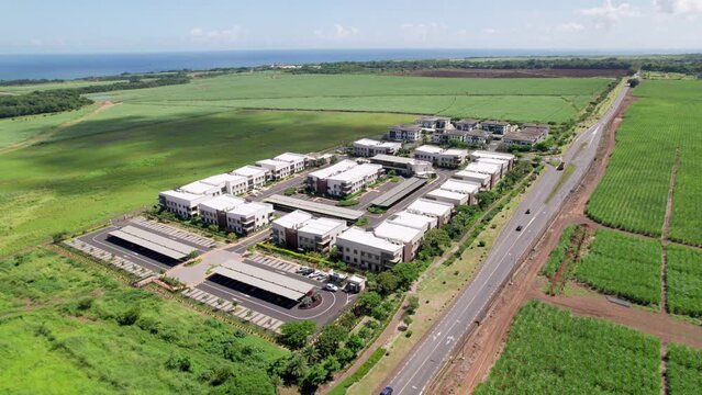 Ecole du nord in mauritius surrounded by lush fields under clear skies, daytime, aerial view
