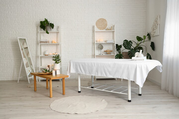 Interior of spa salon with couch and table