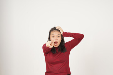 Young Asian woman in Red t-shirt doing Wow or Shock face and pointing at camera isolated on white...