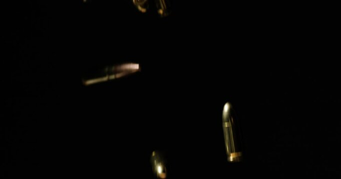 9&times;19mm Parabellum And .300 AAC Blackout Bullets Slowly Falling.