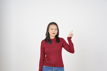 Young Asian woman in Red t-shirt pointing side copy space  isolated on white background