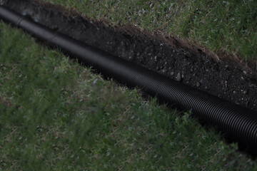 An excavated pit is a ditch for laying cables and wires with corrugated pipes under the ground...