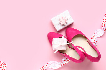 Obraz na płótnie Canvas Beautiful gift boxes with stylish high heels on pink background. Valentines Day celebration