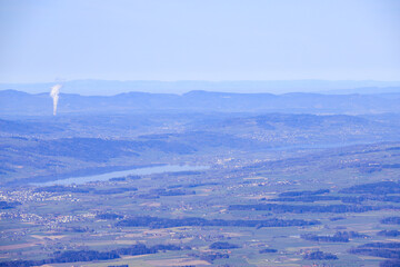 high angle view of lake of hallwil with a power plant in background