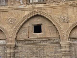 Old house wall in Turkey, old ottoman architecture and wooden historical wall, two crescents and moons symmetrically stand on the wall showing ottoman and Turkish architecture.