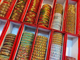 Indian colorful bangles displayed in local shop in a market of Indore, India, These bangles are made of Glass used as beauty accessories by Indian women.