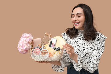 Happy young woman holding Easter basket with different cosmetic products on color background - Powered by Adobe